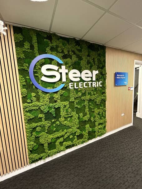 An image of the interior Steer Electric biophilic signage.